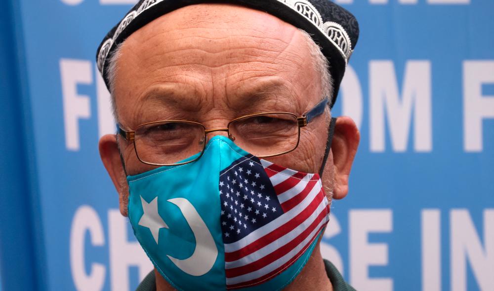 FILE PHOTO: Jamal Rehi takes part in a protest in front of the U.S. State Department to commemorate Uyghur Doppa Day and to urge the U.S. and the international community to take action against China’s treatment of the Uyghur people in the East Turkestan (Xinjiang) region, in Washington, U.S. May 5, 2021. REUTERSPIX