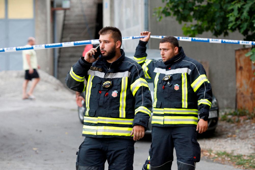 Rescue personnel walks near the crime scene of a mass shooting in Cetinje, Montenegro August 12, 2022. REUTERSpix