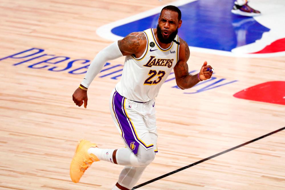 FILE PHOTO: Oct 11, 2020; Lake Buena Vista, Florida, USA; Los Angeles Lakers forward LeBron James (23) celebrates after a play against the Miami Heat during the fourth quarter in game six of the 2020 NBA Finals at AdventHealth Arena. REUTERSPIX