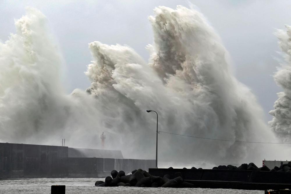 High waves triggered by Typhoon Nanmadol are seen at a fishing port in Aki, Kochi Prefecture, western Japan, September 19, 2022, in this photo taken by Kyodo. - REUTERSPIX