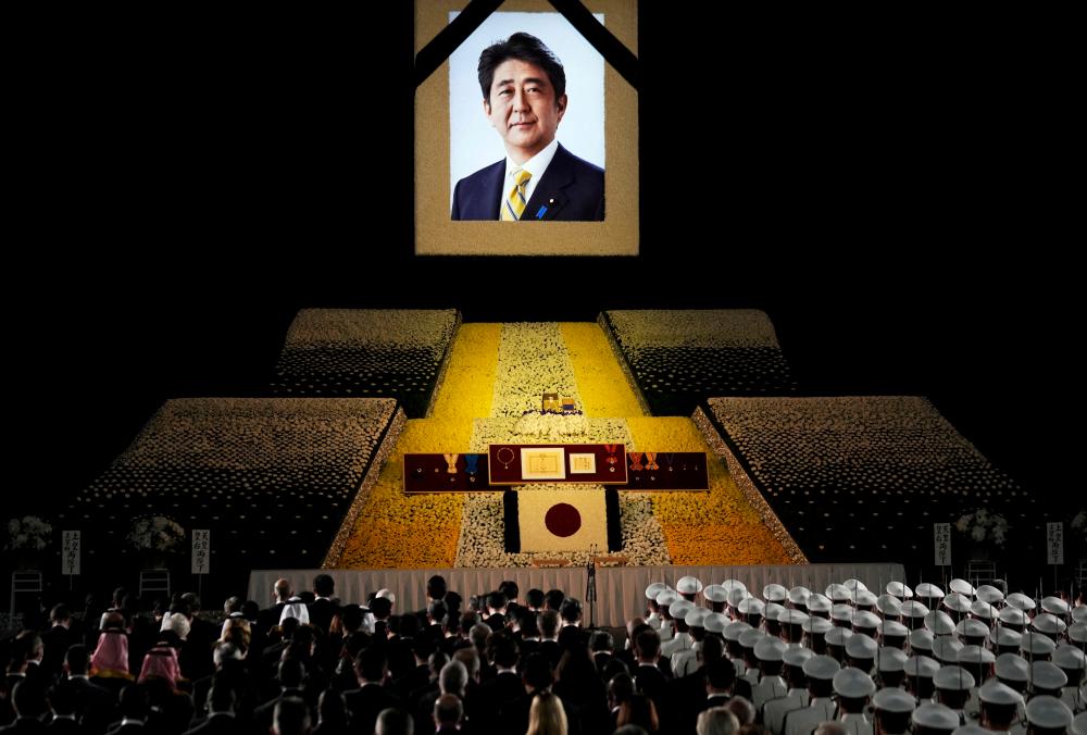 A portrait of former Japanese Prime Minister Shinzo Abe hangs on the stage during the state funeral of former Japanese Prime Minister Shinzo Abe at Nippon Budokan in Tokyo, Japan/REUTERSPix