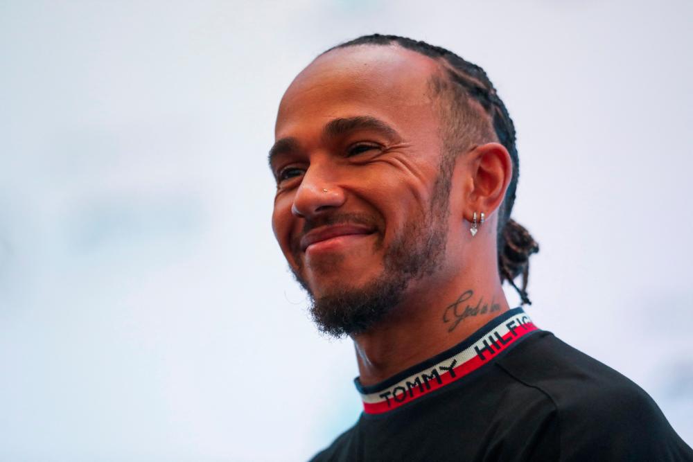 Mercedes-AMG Petronas Formula One Team driver Lewis Hamilton gestures during a news conference in Kuala Lumpur, Malaysia, ahead of the Singapore Grand Prix, September 28, 2022. - REUTERSPIX