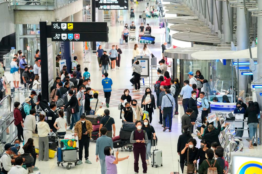 Tourists arrive, ahead of brace of an influx of Chinese tourists as Covid restriction are dismantled, at Bangkok’s Suvarnabhumi airport, Thailand, January 4, 2023. REUTERSpix