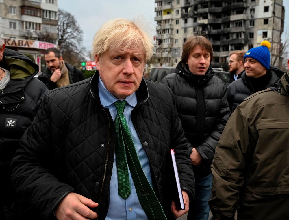 Former British Prime Minister Boris Johnson visits the town of Borodianka, heavily damaged during Russia’s invasion of Ukraine, outside of Kyiv, Ukraine January 22, 2023. REUTERSpix