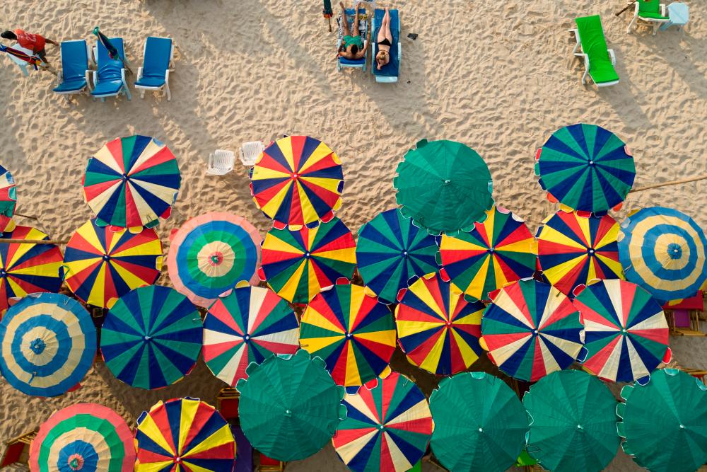 Colourful umbrellas are seen in a restaurant as tourists enjoy a beach in the island of Phuket in Thailand January 19, 2023. REUTERSpix