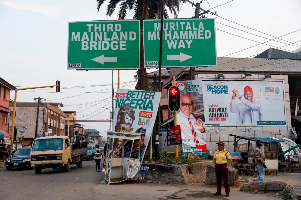 Electoral campaign posters are seen at a crossroads ahead of Nigeria’s presidential election in Lagos, Nigeria January 31, 2023. REUTERSPIX