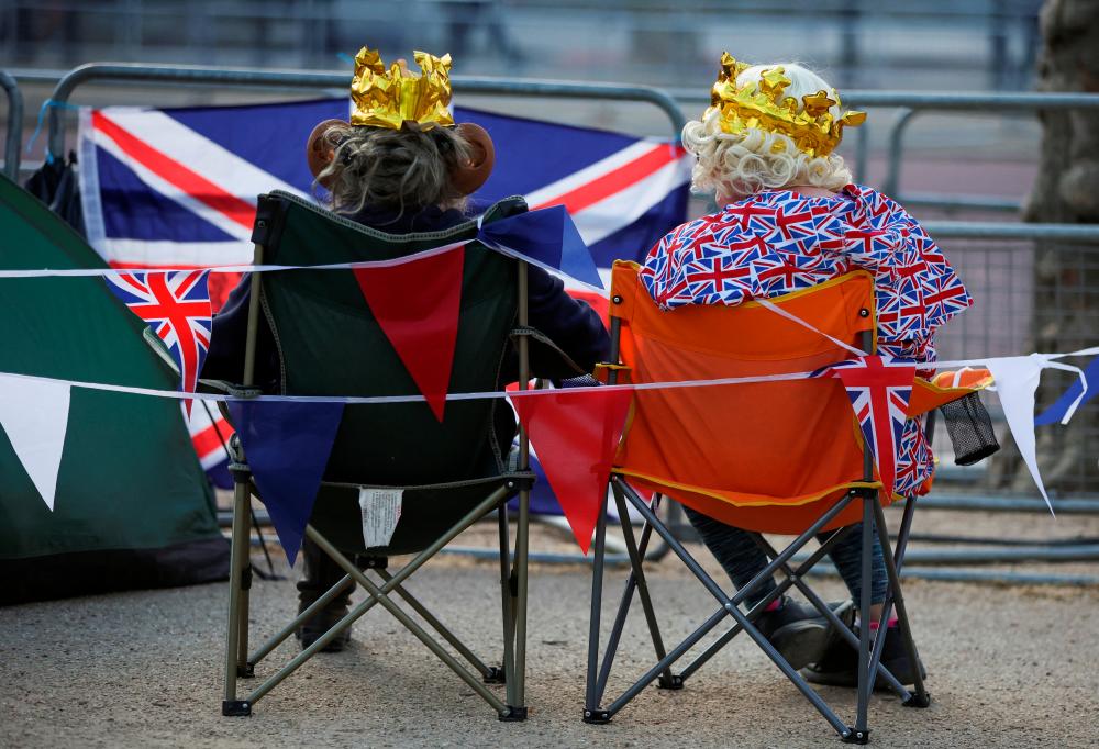 Royal fans wait at the Mall, ahead of the Coronation of Britain’s King Charles and Camilla, Queen Consort, in London, Britain May 4, 2023. REUTERSpix