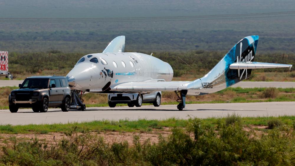 Virgin Galactic’s passenger rocket plane VSS Unity is towed to the hangar after billionaire entrepreneur Richard Branson and his crew, reached the edge of space, at Spaceport America near Truth or Consequences, New Mexico, U.S., July 11, 2021/REUTERSPix