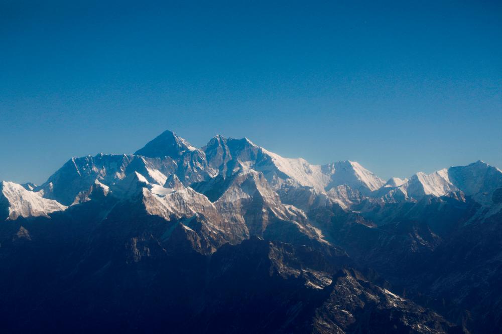 Mount Everest, the world highest peak, and other peaks of the Himalayan range are seen through an aircraft window during a mountain flight from Kathmandu, Nepal January 15, 2020. REUTERSPIX