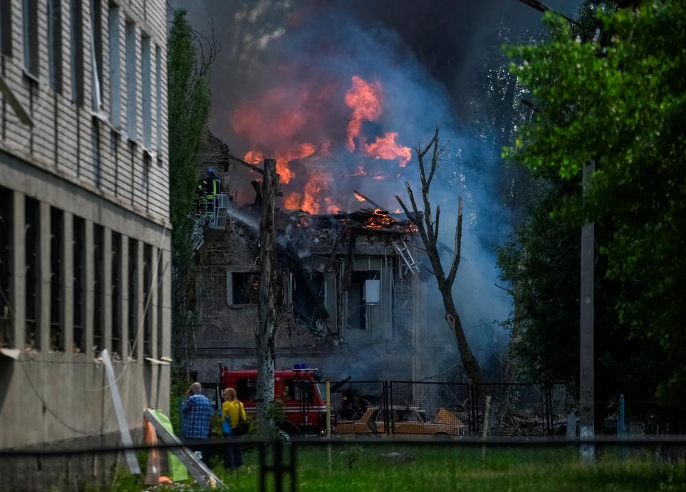 A rescuer works at a site of a clinic heavily destroyed by a Russian missile strike, amid Russia’s attack on Ukraine, in Dnipro, Ukraine May 26, 2023. REUTERSPIX