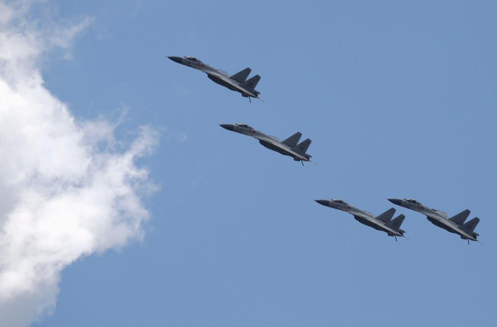 FILE PHOTO: J-11B fighter jets of the Chinese Air Force fly in formation during a training session for the upcoming parade marking the 70th anniversary of the end of World War Two, on the outskirts of Beijing, July 2, 2015. REUTERSPIX