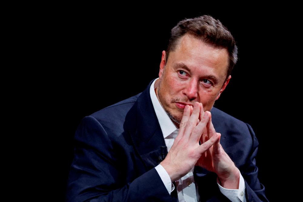 FILE PHOTO: Elon Musk gestures as he attends the Viva Technology conference dedicated to innovation and startups at the Porte de Versailles exhibition centre in Paris, France, June 16, 2023. - REUTERSPIX