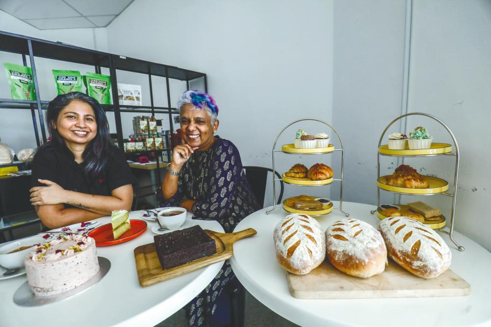 Sita Lakshmi and Sheila Philip with their cakes, bread and pastry creations from Vickedgood.