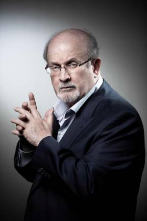 (FILES) In this file photo taken on September 10, 2018, British novelist and essayist Salman Rushdie poses during a photo session in Paris. Salman Rushdie, who spent years in hiding after an Iranian fatwa ordered his killing, was on a ventilator and could lose an eye following a stabbing attack at a literary event in New York state on August 11, 2022. - AFPPIX