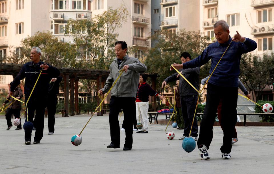 Retirees practice “Cola Ball” with music, an invented community activity in central Beijing, October 17, 2013. Picture taken October 17, 2013. REUTERSpix