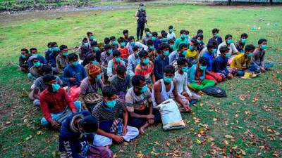 Myanmar arrests about 150 Rohingya fleeing to Malaysia