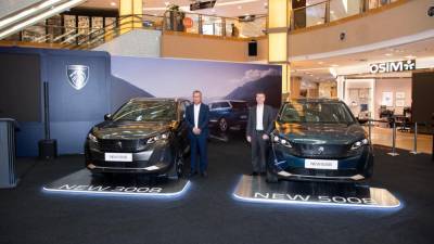 Yeoh (left) posing alongside Stellantis’ Asean &amp; general distributors senior vice president, Christophe Musy at the launch of Peugeot 3008 and Peugeot 5008.