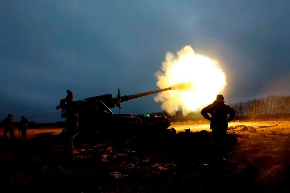 Ukrainian soldiers with the 43rd Heavy Artillery Brigade fire a projectile from a 2S7 Pion self propelled cannon, as Russia’s attack on Ukraine continues, during intense shelling on the front line in Bakhmut, Ukraine, December 26, 2022. REUTERSPIX