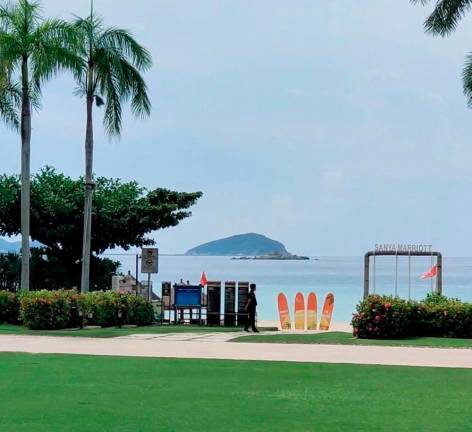 A guard patrols the Marriott beachside hotel amid a COVID-19 lockdown in Sanya, Hainan, China August 9, 2022 in this still image obtained from social media video. - REUTERSPIX