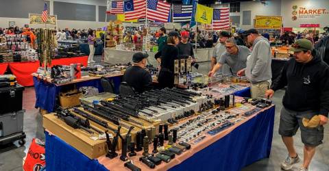 At California gun fair, few speak of recent massacres