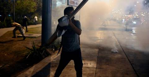 Protesters brave tear gas to demand ouster of Peru’s embattled leader