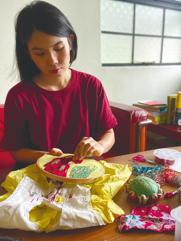 Chong working on textile art. – Pictures courtesy of Chong Yi Lin