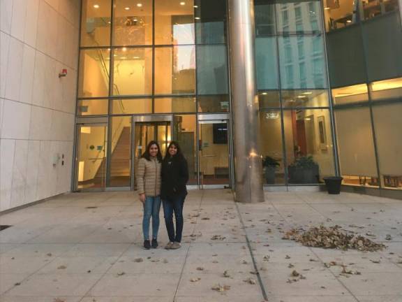 Aishah (left) in front of the McGovern Institute for Brain Research, MIT where she did her research attachment programme.