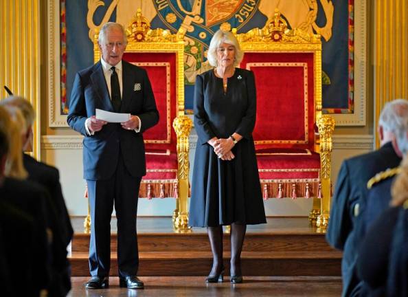 Britain’s King Charles III, flanked by Britain’s Camilla, Queen Consort, makes a speech after receiving a message of condolence following the death of his mother Queen Elizabeth II, at Hillsborough Castle in Belfast on September 13, 2022, during his visit to Northern Ireland/AFPPix