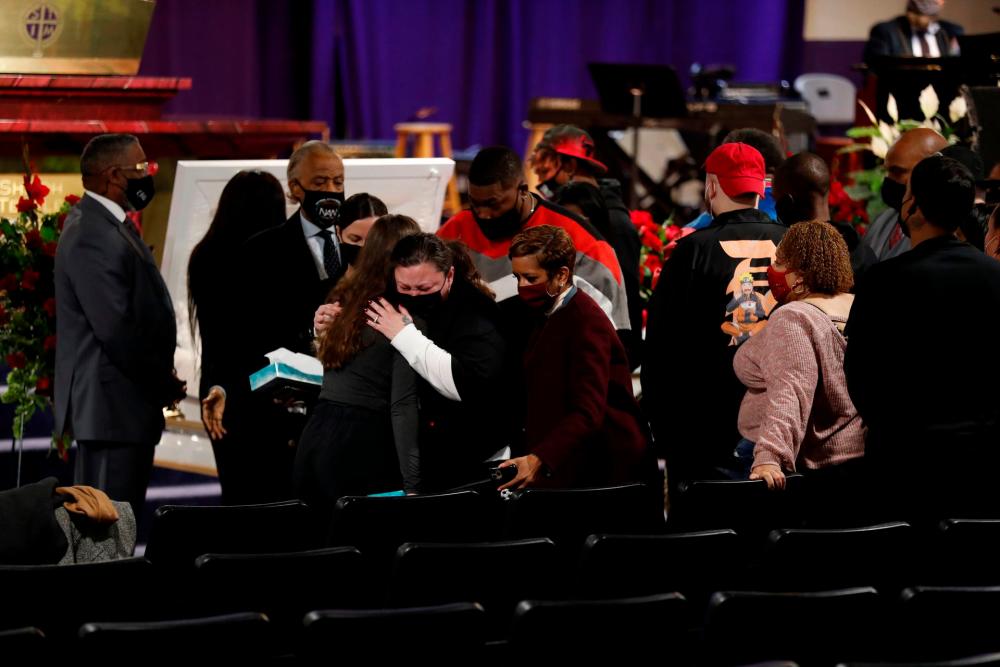 Katie Wright, the mother of Daunte Wright is comforted by mourners paying their respects for Daunte Wright, who was shot and killed by Brooklyn Center Police officer Kim Potter, at his public viewing at Shiloh Temple International Ministries in Minneapolis, Minnesota, U.S., April 21, 2021. REUTERSPIX
