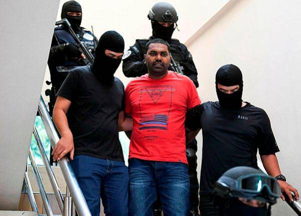 Filepix of V. Balamurugan, 37, who was previously accused of giving support to terrorist group LTTE, being brought out of the sessions court on Dec 12 - Bernama