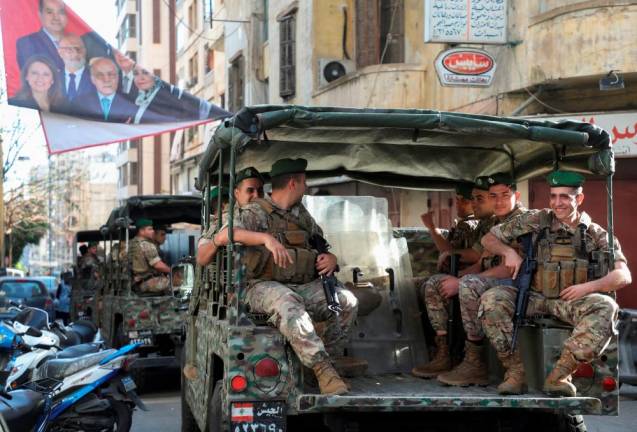 Lebanese army patrol near a polling station during Lebanon's parliamentary election, in Beirut, Lebanon May 15, 2022. REUTERSPIX