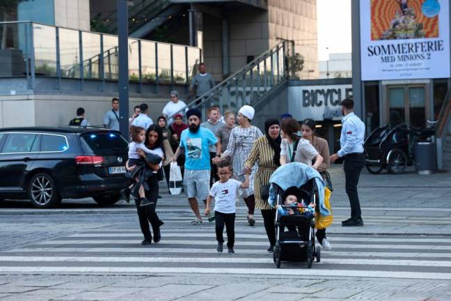People are seen running during the evacuation of the Fields shopping center in Copenhagen, Denmark/AFPPix