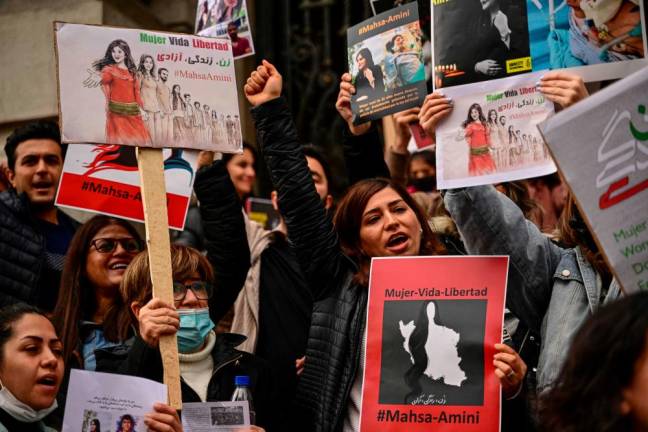 Women members of feminist groups and Iranians migrants hold a demonstration in support of Mahsa Amini in Santiago/AFPPix