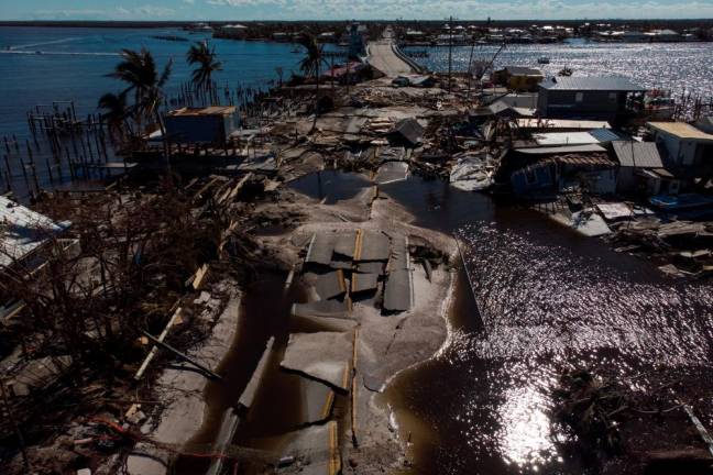 A view of the destroyed road between Matlacha and Pine Island after Hurricane Ian caused widespread destruction in Matlacha, Florida, U.S., October 2, 2022. - REUTERSPIX