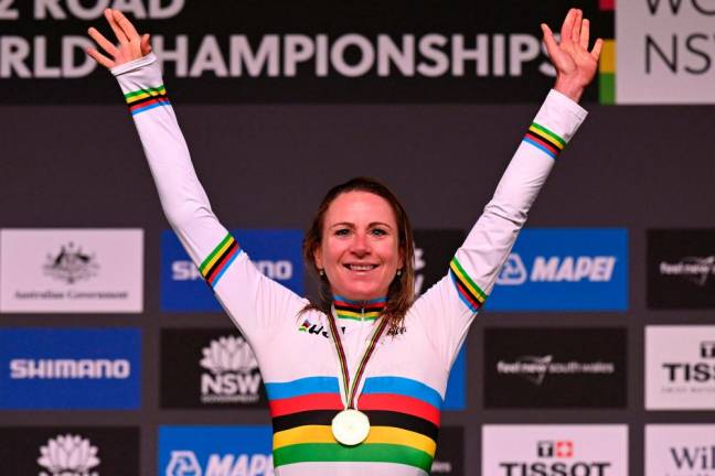 Annemiek Van Vleuten of Netherlands celebrates on the podium after winning the women’s road race cycling event at the UCI 2022 Road World Championship in Wollongong/AFPPix