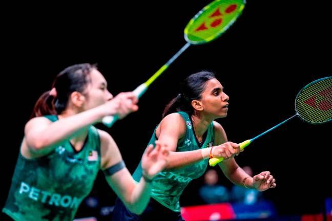 Pearly Tan (L) and Thinaah Muralitharan play against Japan’s Mayu Matsumoto and Wakana Nagahara (not pictured) during their second round women’s double match at the BWF Badminton World Championship in Copenhagen, Denmark, on August 24, 2023. AFPPIX