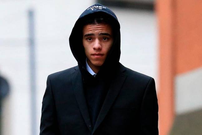 England and Manchester United footballer Mason Greenwood leaves Minshull Street Crown Court in Manchester on November 21, 2022 after a preliminary hearing on charges of attempted rape, controlling and coercive behaviour, and assault/AFPPix