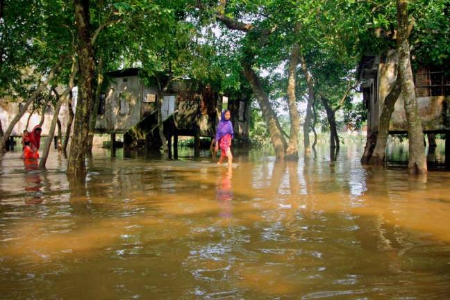 North-east Bangladesh’s worst floods in nearly 20 years began receding on May 22, but rescue workers were struggling to help millions marooned by extreme weather across the region that has killed around 60 people/AFPPix