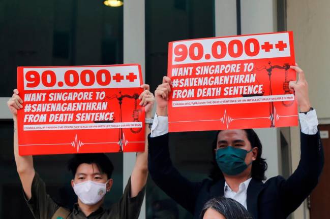 Activists hold up placards against the imminent execution of Nagaenthran Dharmalingam, who was sentenced to death for drug trafficking in Singapore, outside the Singapore High Commission in Kuala Lumpur, Malaysia/REUTERSPix