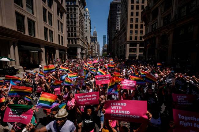 Participants march during the 2022 New York Pride Parade in New York City on June 26, 2022/AFPPix