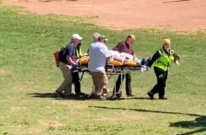 Author Salman Rushdie is transported to a helicopter after he was stabbed on stage before his scheduled speech at the Chautauqua Institution, Chautauqua/REUTERSPix