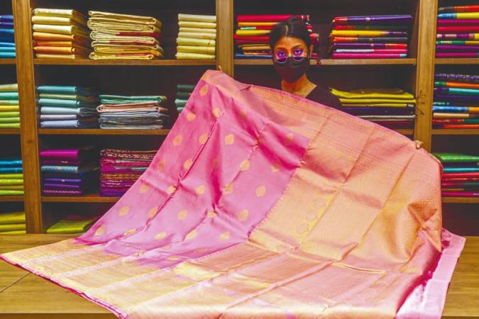 A pastel pink saree at Manjal Silk.