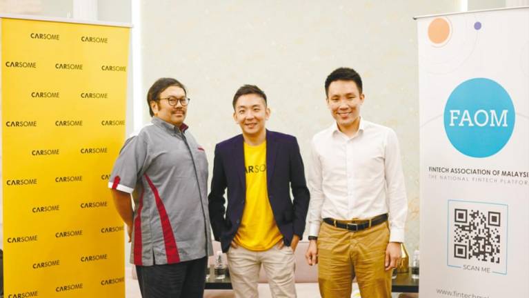 From left: Thariq, Cheng and FinTech Association of Malaysia president Wilson Beh at the event to share the latest trends in the fintech industry and provide updates on the KAF-led consortium.