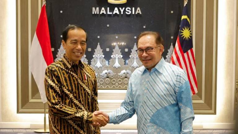 Prime Minister Datuk Seri Anwar Ibrahim welcomes Indonesian President Joko Widodo, who is on a two-day working visit to Malaysia, at Seri Perdana, Putrajaya on June 8 2023. - fotoBERNAMA