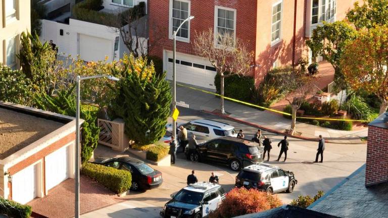 (FILES) This file photo taken on October 28, 2022, shows an aerial view as San Francisco police officers and FBI agents gather in front of the home of US Speaker of the House Nancy Pelosi (D-CA) in San Francisco, California. AFPPIX