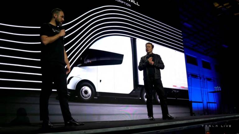 Tesla Chief Executive Elon Musk speaks with Dan Priestly, Senior Manager of Tesla Semi Truck Engineering, during the live-streamed unveiling of the Tesla Semi electric truck, in Nevada, US December 1, 2022. REUTERSPIX