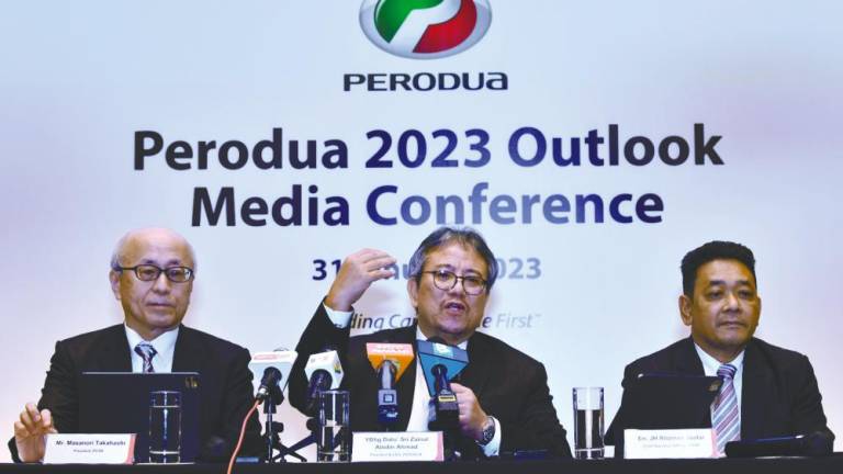 From left: Perodua Auto Corp Sdn Bhd president, Masanori Takahashi, Zainal, and Perodua Sales Sdn Bhd COO JH Rozman Jaafar at the press conference.