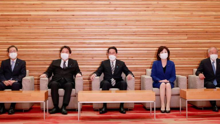 Japan's Prime Minister Fumio Kishida (C) attends an extraordinary cabinet meeting at the prime minister's official residence in Tokyo on August 10, 2022, ahead of an expected cabinet reshuttle. - AFPPIX