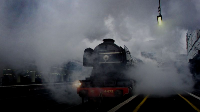 The world famous “Flying Scotsman” steam locomotive, holder of three steam speed records, pulls out of Victoria Station in London March 13, 2002. REUTERSPIX