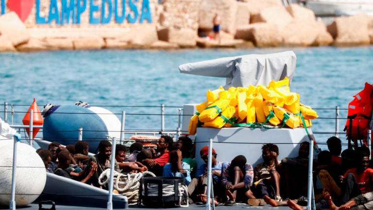 Migrants arrive on an Italian Coast Guard vessel after being rescued at sea, on the Sicilian island of Lampedusa, Italy, September 18, 2023. REUTERSPIX